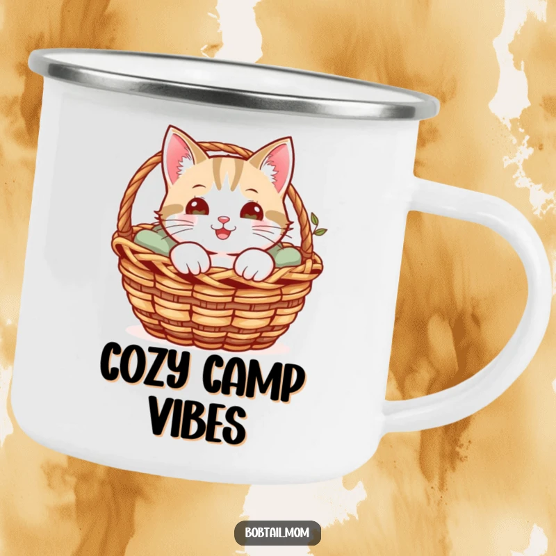 Funny camping mug with a cheerful Bobtail cat peeking from a cozy basket, ready for outdoor observation.