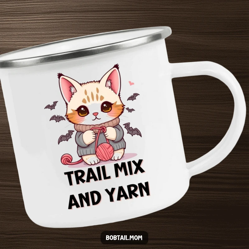 Funny Bobtail cat in a warm sweater, batting at yarn, perfect for outdoor adventures and morning brews.