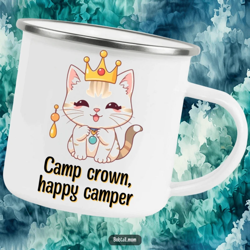 Funny Royal Bobtail Cat Camping Mug: Cat with a crown batting a charm, perfect for campfire brews with regal humor.