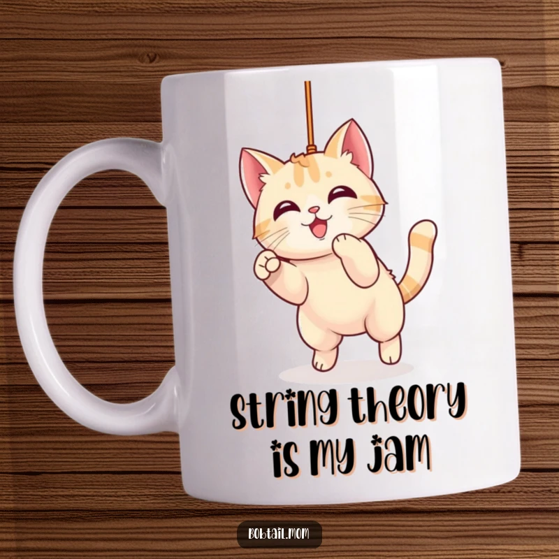 Funny Kawaii Bobtail Cat Mug showing a cute cat playfully pouncing with intense focus on a dangling string, bringing joy and humor.