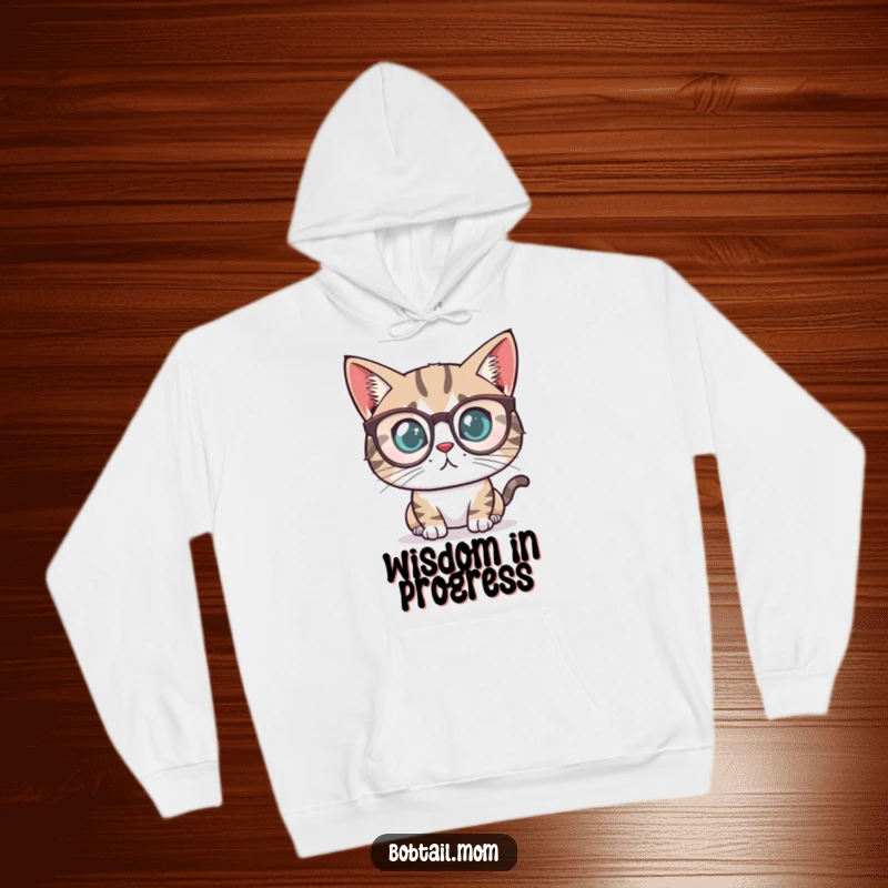 Funny Bobtail cat with a determined look wearing tiny reading glasses, featured on a soft, cozy hoodie.