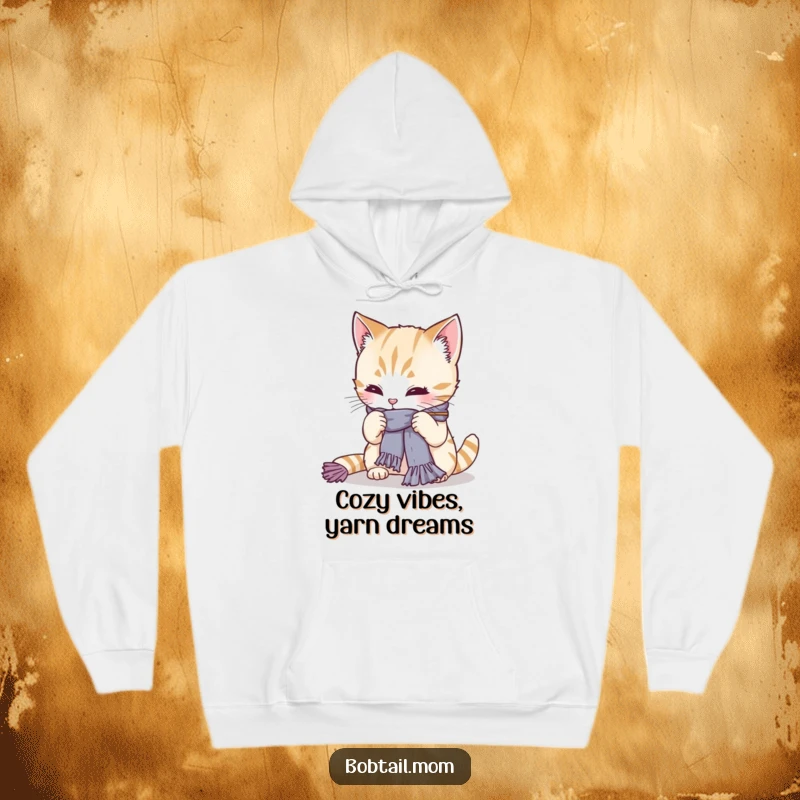 Funny Bobtail cat intensely knitting a tiny scarf, looking super focused. A warm and humorous hoodie for cat lovers and crafters, an ideal gift.