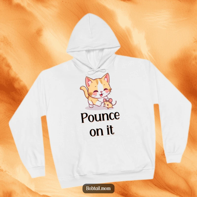 Funny Bobtail cat hoodie featuring a jolly cat playfully pouncing on a toy mouse, designed for cozy, playful comfort.