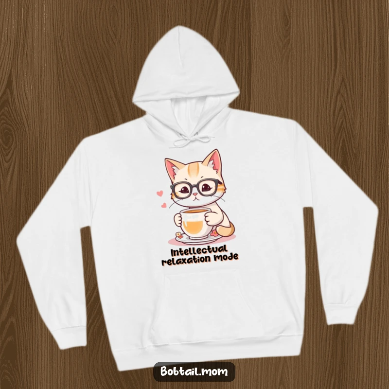 Funny hoodie depicting a bobtail cat wearing reading glasses, savoring tea, embodying a sophisticated and humorous persona.