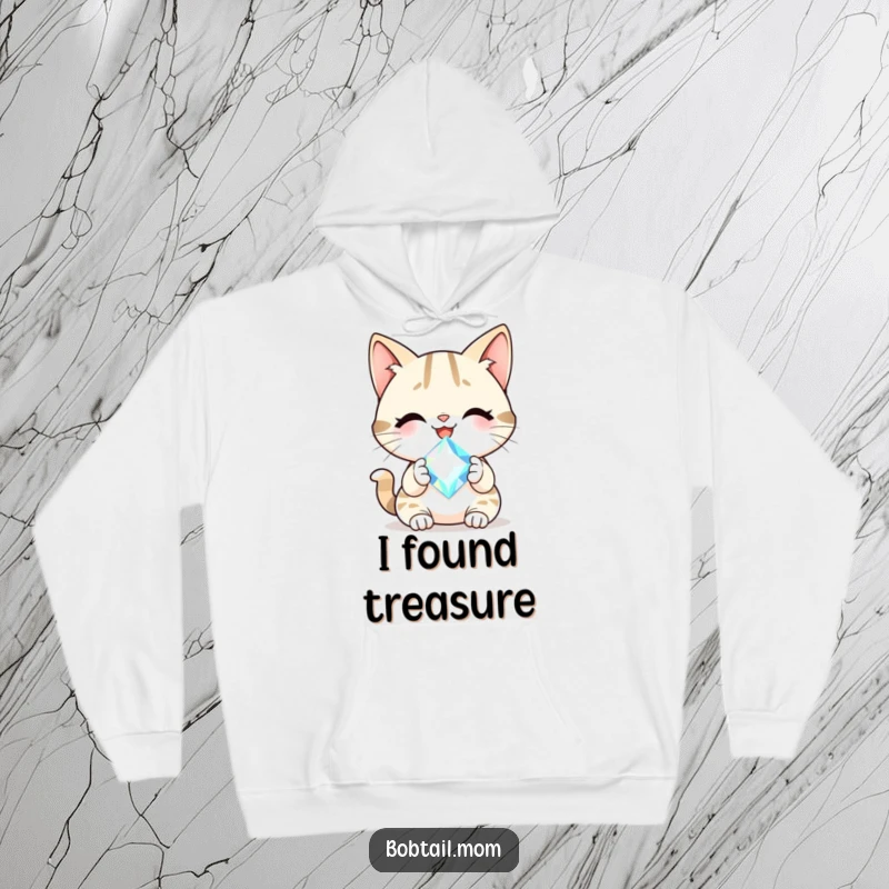 Funny Bobtail cat with a cheerful smile holding a sparkling gem, featured on a soft, cozy hoodie.