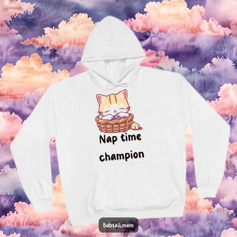 Funny hoodie with a Bobtail cat peacefully napping in a knitting basket, adorned with soft yarn, embodying ultimate relaxation.