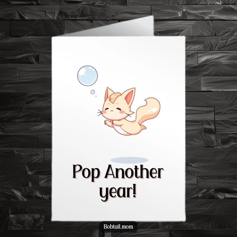 Funny Free Printable Birthday Card: A Bobtail cat gracefully leaps to catch a shimmering floating bubble with playful determination.