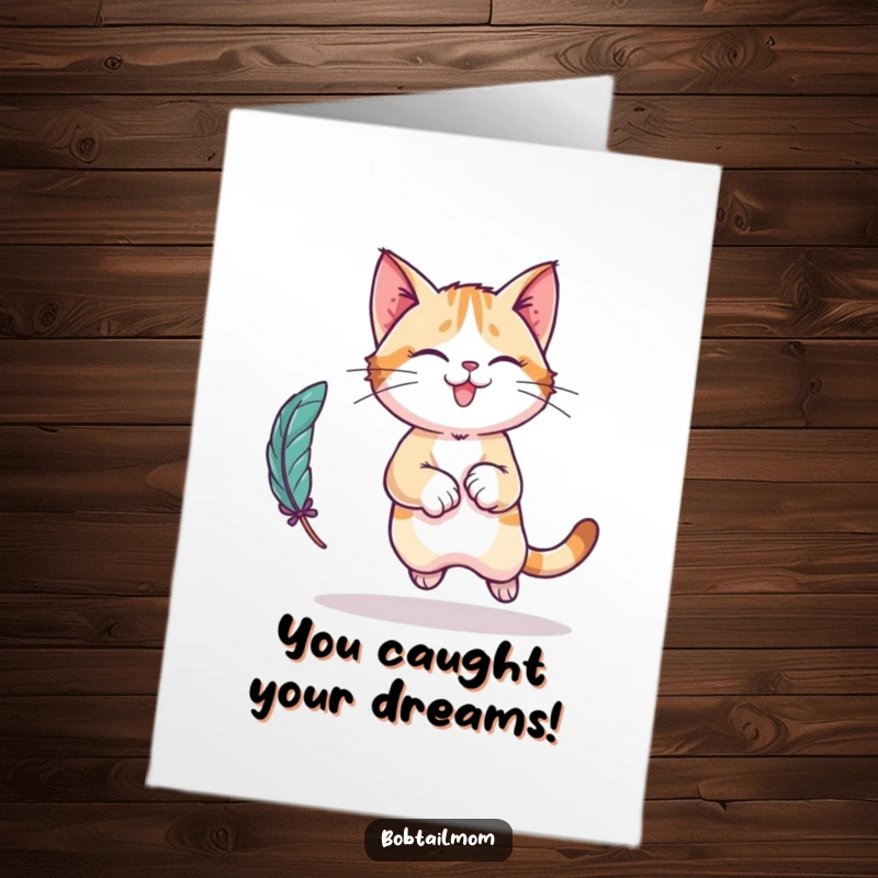 Funny Free Printable Congratulations Card: A Bobtail cat character leaping playfully after a feather toy.