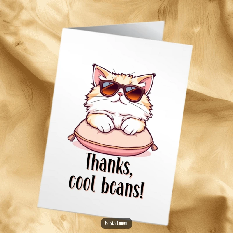 Funny Free Printable Thank You Card: A fluffy Bobtail cat with oversized sunglasses lounging stylishly on a tiny cushion.