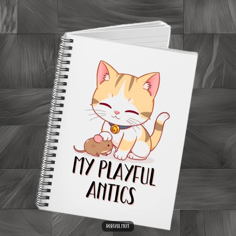 Funny Bobtail cat with a bell collar playfully nudging a toy mouse, presented as a notebook for jotting ideas.