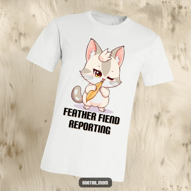 Funny Bobtail T-Shirt: A mischievous bobtail cat playfully bats at a feather, perfect for a humorous and fun apparel gift.